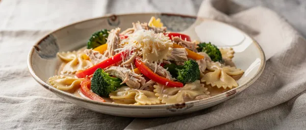 Hähnchen mit Farfalle in Rahmsauce